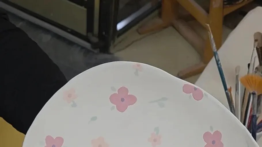 Decorated ceramic plate with floral design.