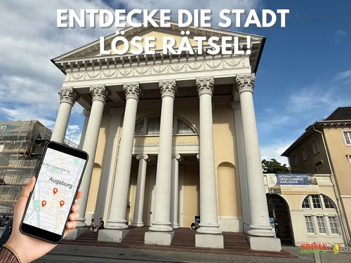 Hand holds phone with Augsburg map, building background.