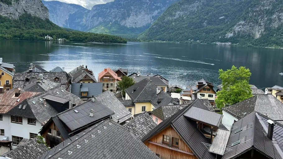 Rooftops view overlooking a scenic mountain lake.