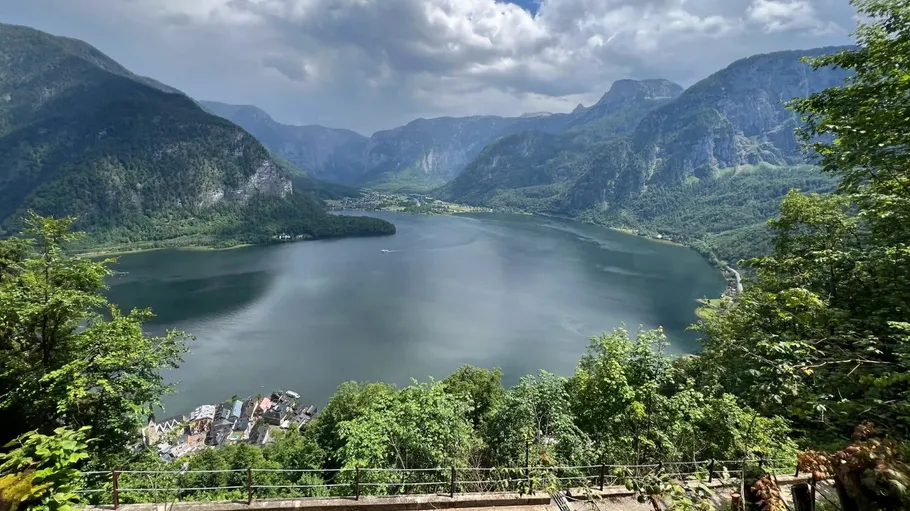 Mountain lake surrounded by lush green hills.