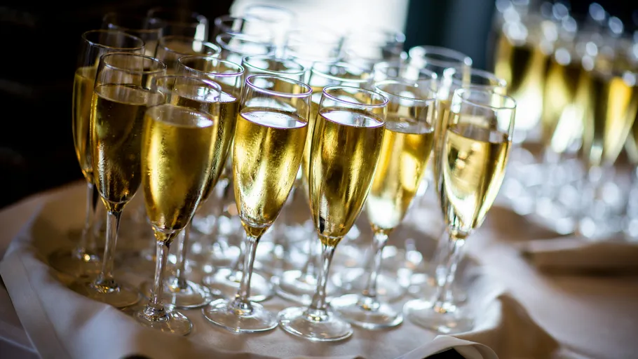 Champagne glasses arranged on a table.