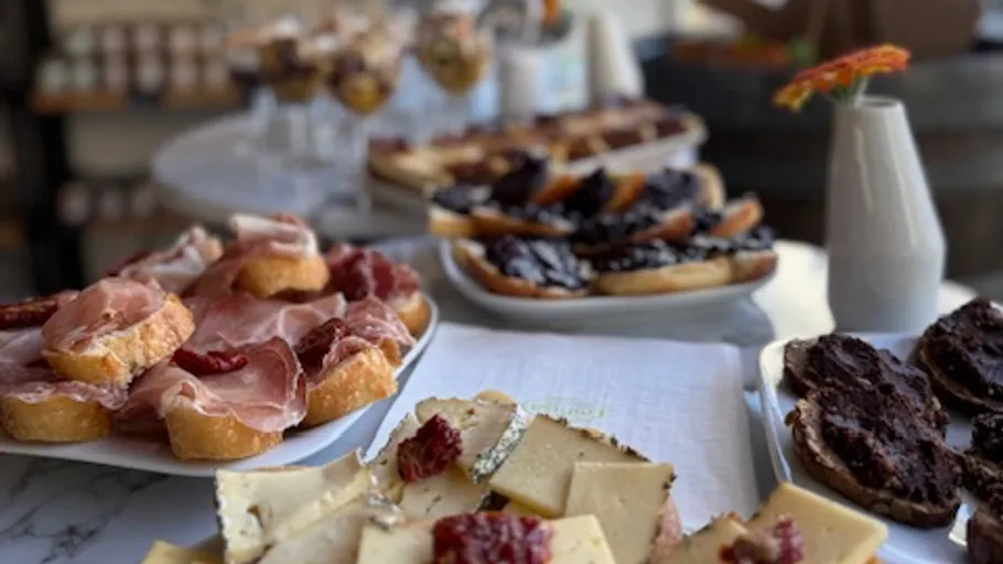 Plates of appetizers including cheese and meats.