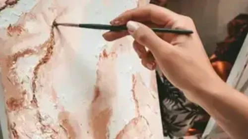 Hand painting on canvas with brush.