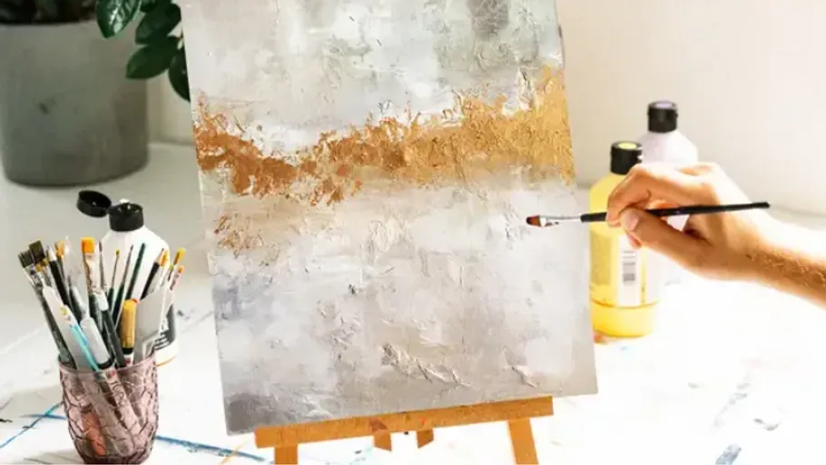 Hand painting abstract art on a canvas.