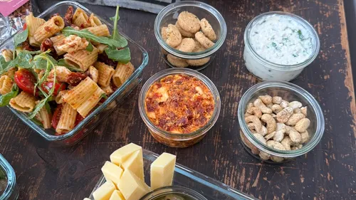 Various appetizers and snacks on a wooden table.