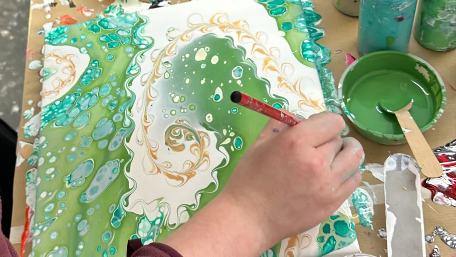 Hand painting colorful abstract design on canvas.