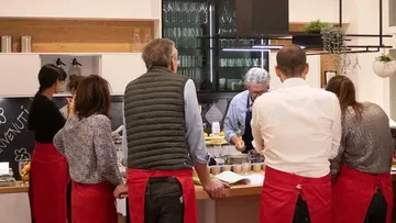 Group cooking class in a modern kitchen.