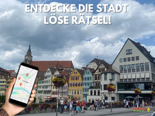 Hand holding phone in front of colorful buildings.