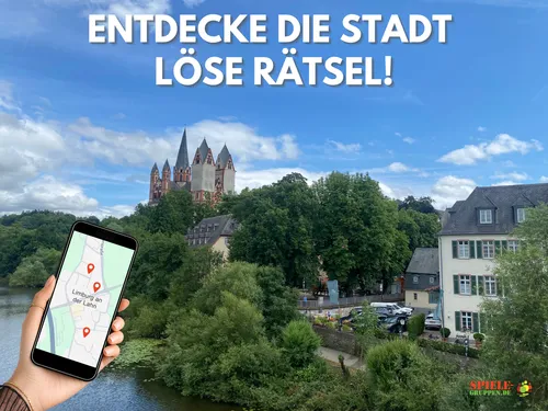 Smartphone mit Karte, Limburger Dom im Hintergrund.