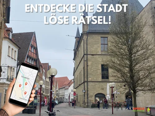 Hand holds phone showing city map, street view.