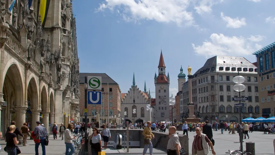 People walking in a busy city square.