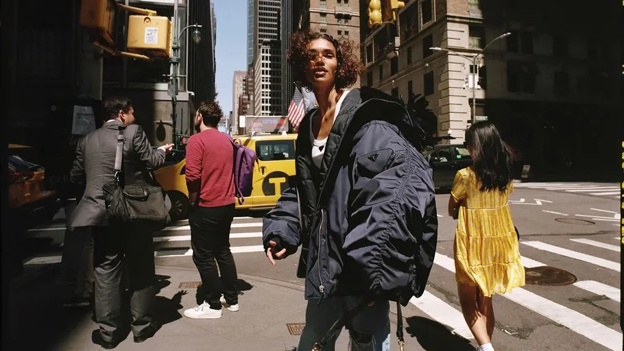 Stylish person walking on a busy city street.