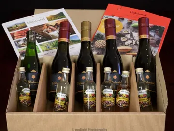 Six bottles of wine and liquors in a box.