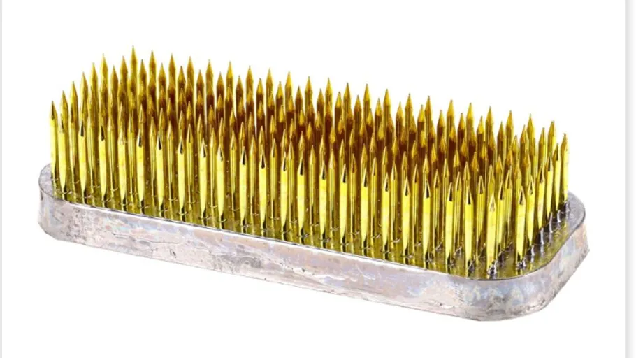 Metal spike flower holder on white background.