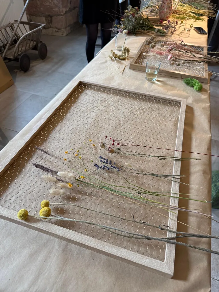 Dried flowers placed on a wire frame.
