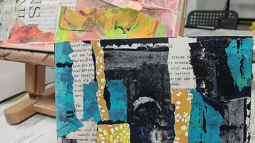 Colorful abstract art pieces on an easel.