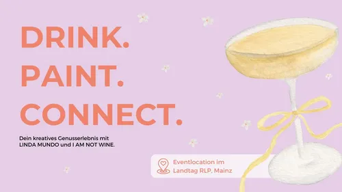 Sektglas mit Schleife auf lila Hintergrund.