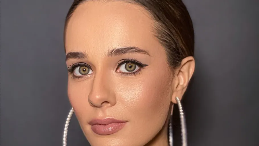 Woman with large earrings, close-up portrait.
