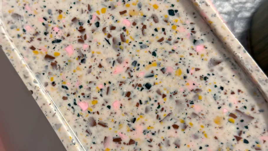 Colorful speckled surface with terrazzo pattern.