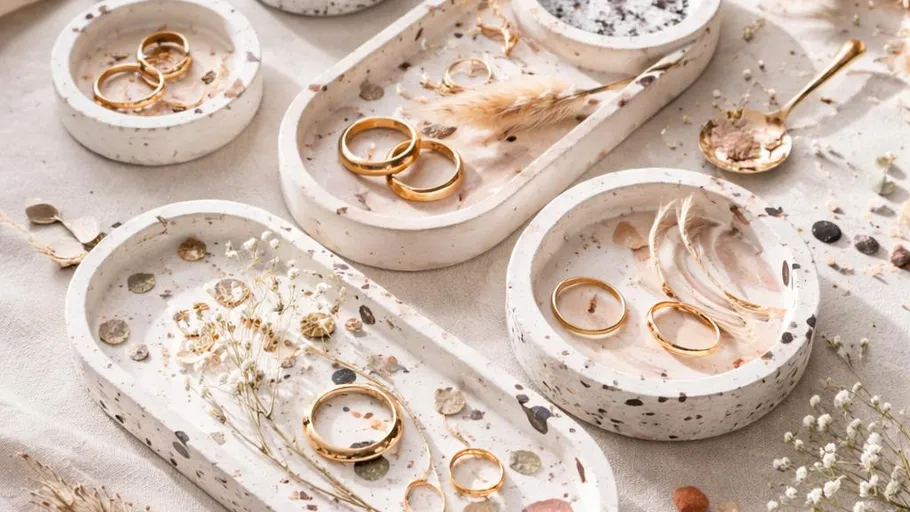 Gold rings on decorative ceramic trays.