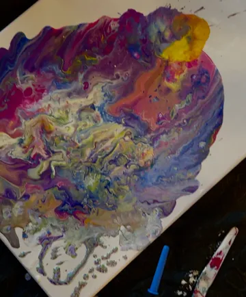 Abstract painting with vibrant swirling colors.