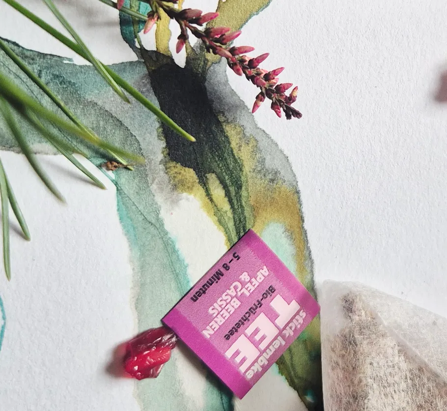 Purple tea bag on watercolor painting.