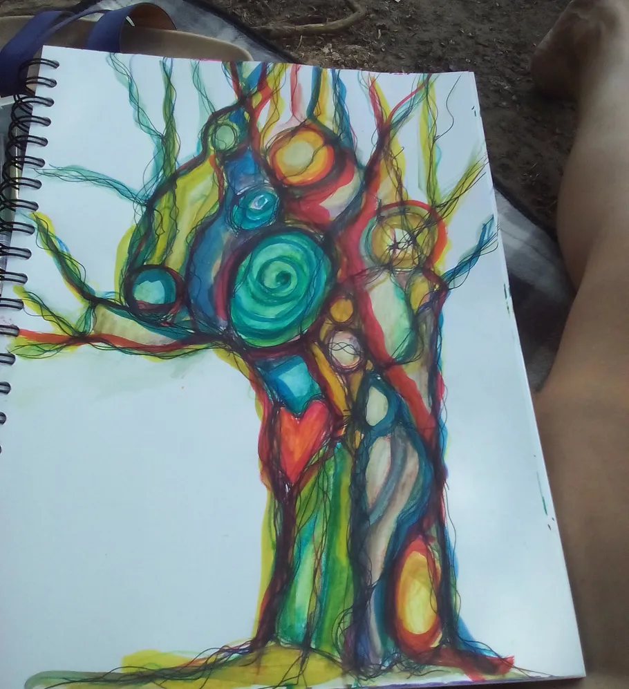 Colorful abstract tree drawing on sketchbook.