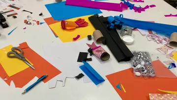 Craft supplies scattered on a table.
