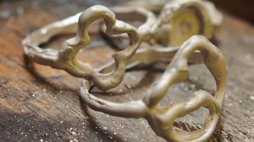 Metal rings on a wooden surface.