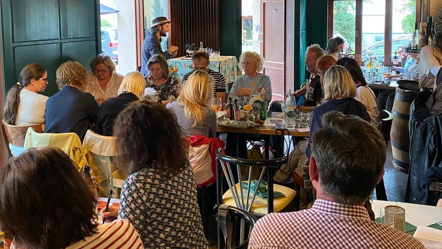 Group of people dining in a cozy restaurant.