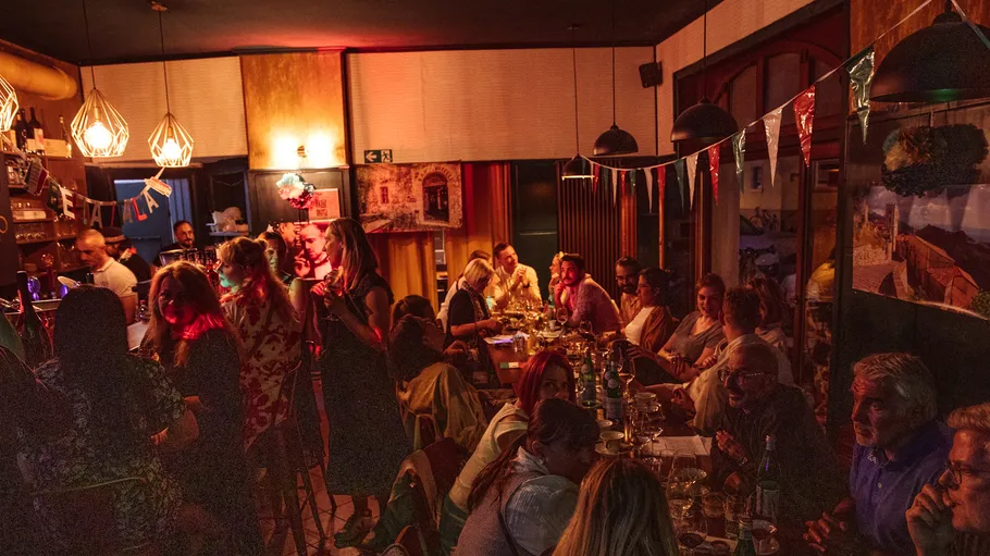People socializing in a cozy restaurant setting.