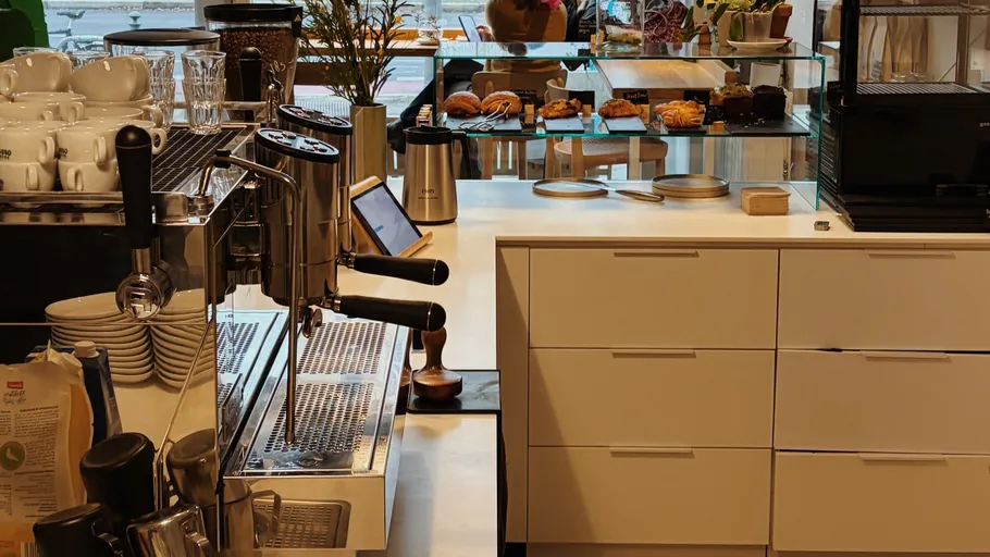 Coffee machine on counter in cafe.