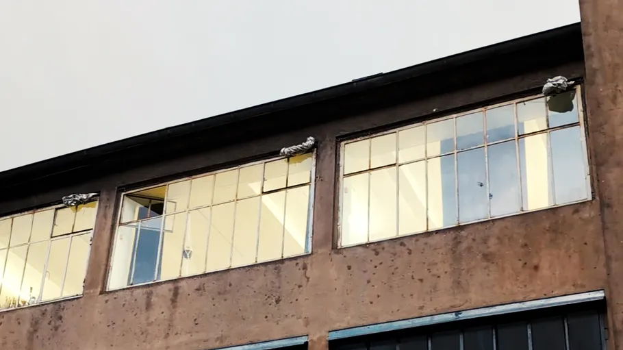 Old building facade with broken windows.