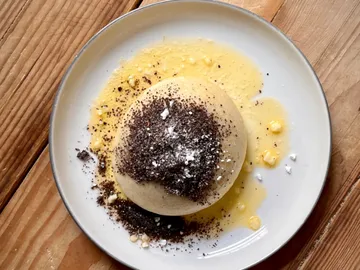 A round dish with chocolate chips on a plate.