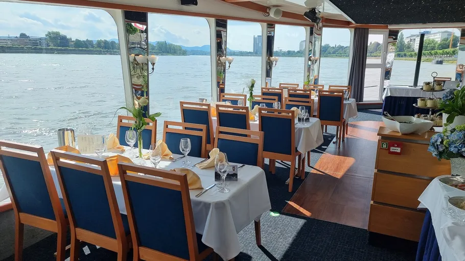 Dining tables set in a boat restaurant.