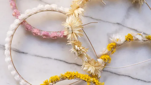 Floral wreaths on marble surface.