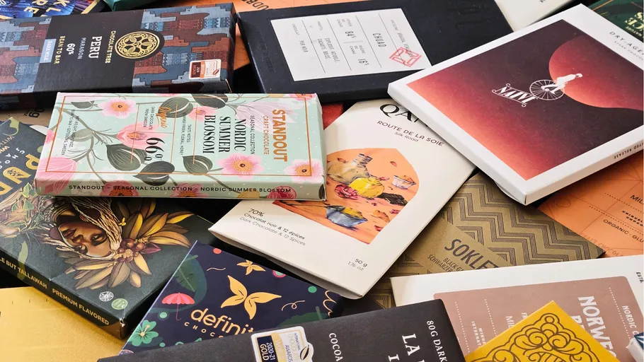 Assorted chocolate bar packaging laid out.