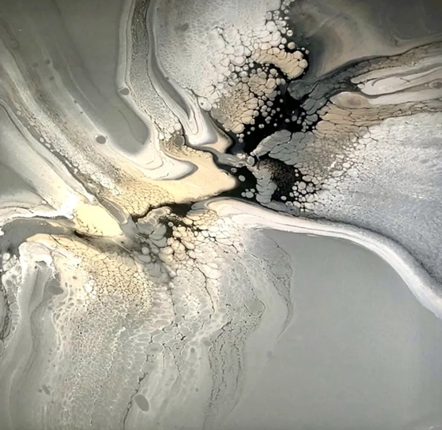 Abstract paint with gray and gold swirls.