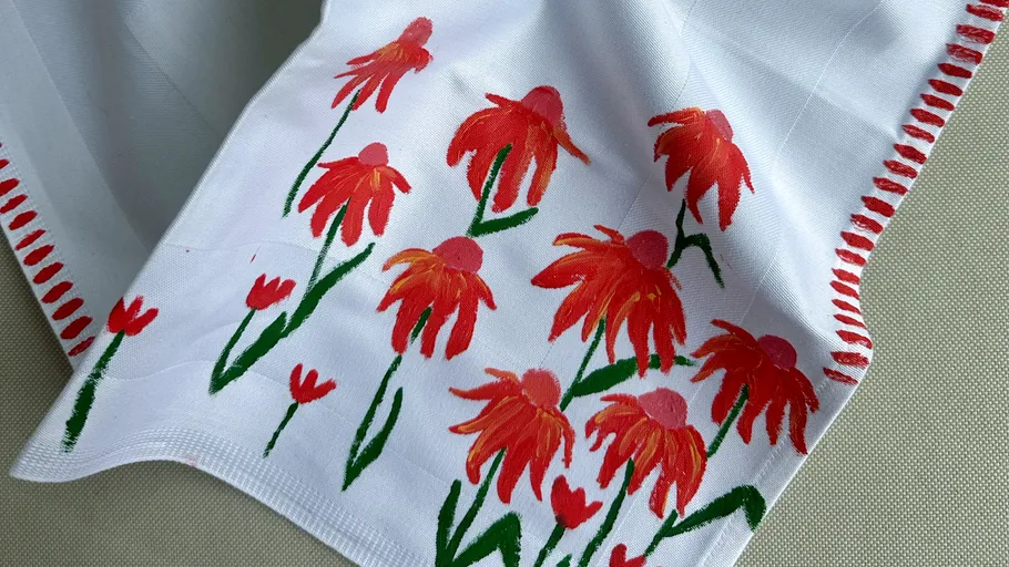 White fabric with red flower paintings.