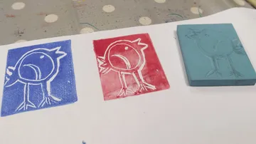 Bird prints in blue and red, with a stamp.