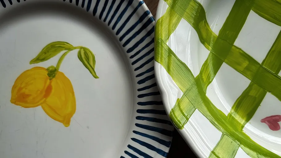 Two decorative plates with painted designs.