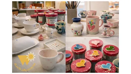 Painted pottery and paints on a table.