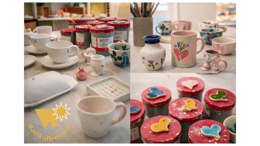Painted pottery and paints on a table.