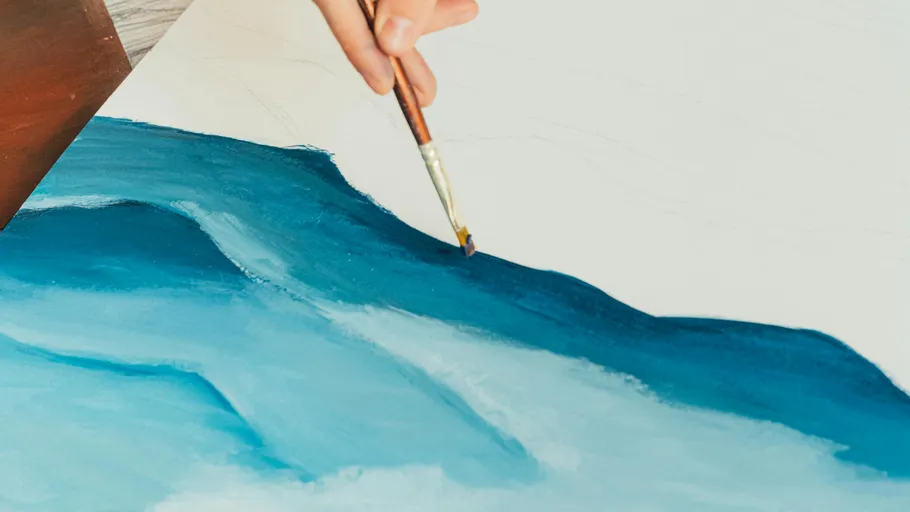 Hand painting blue wave on canvas.