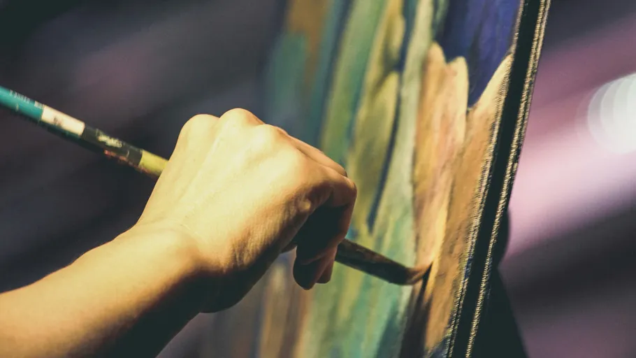 Hand painting on canvas with brush.