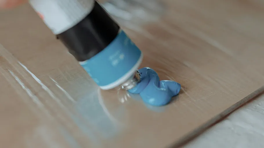 Blue paint squeezed from tube onto a surface.