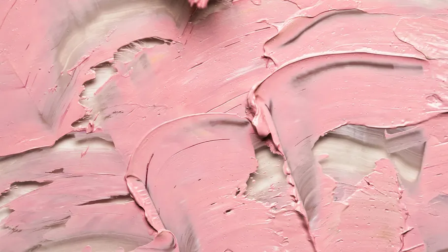 Pink paint texture with brush strokes.