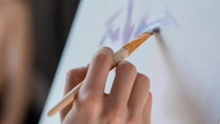 Hand painting on canvas with brush.