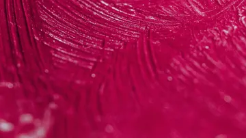 Close-up of red textured paint surface.