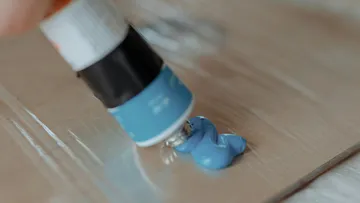 Blue paint squeezed onto a palette.